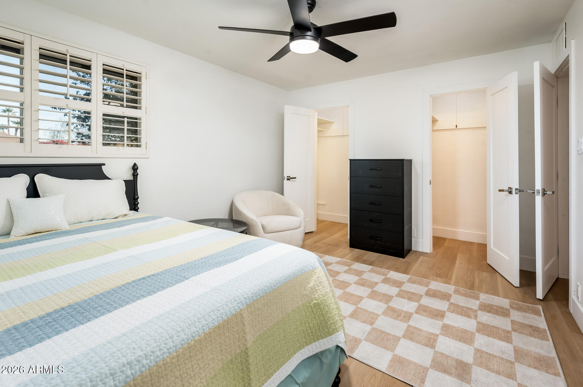 4112 6th Avenue Northwest Phoenix, AZ 85013 - Photo 18 of 23 a bedroom with a bed and a walk in closet