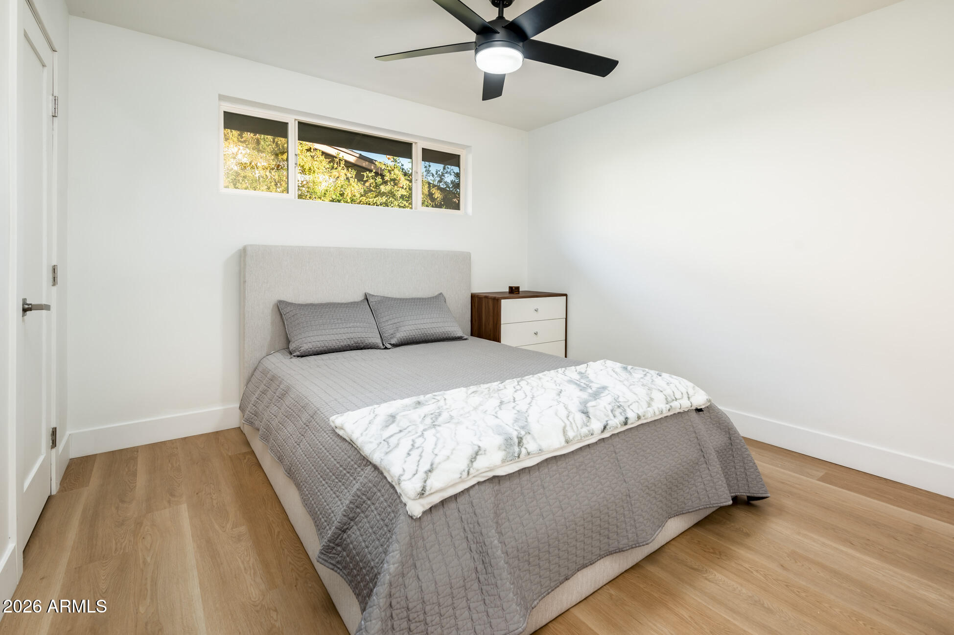 4112 6th Avenue Northwest Phoenix, AZ 85013 - Photo 19 of 23 a bedroom with a bed and painting on the wall