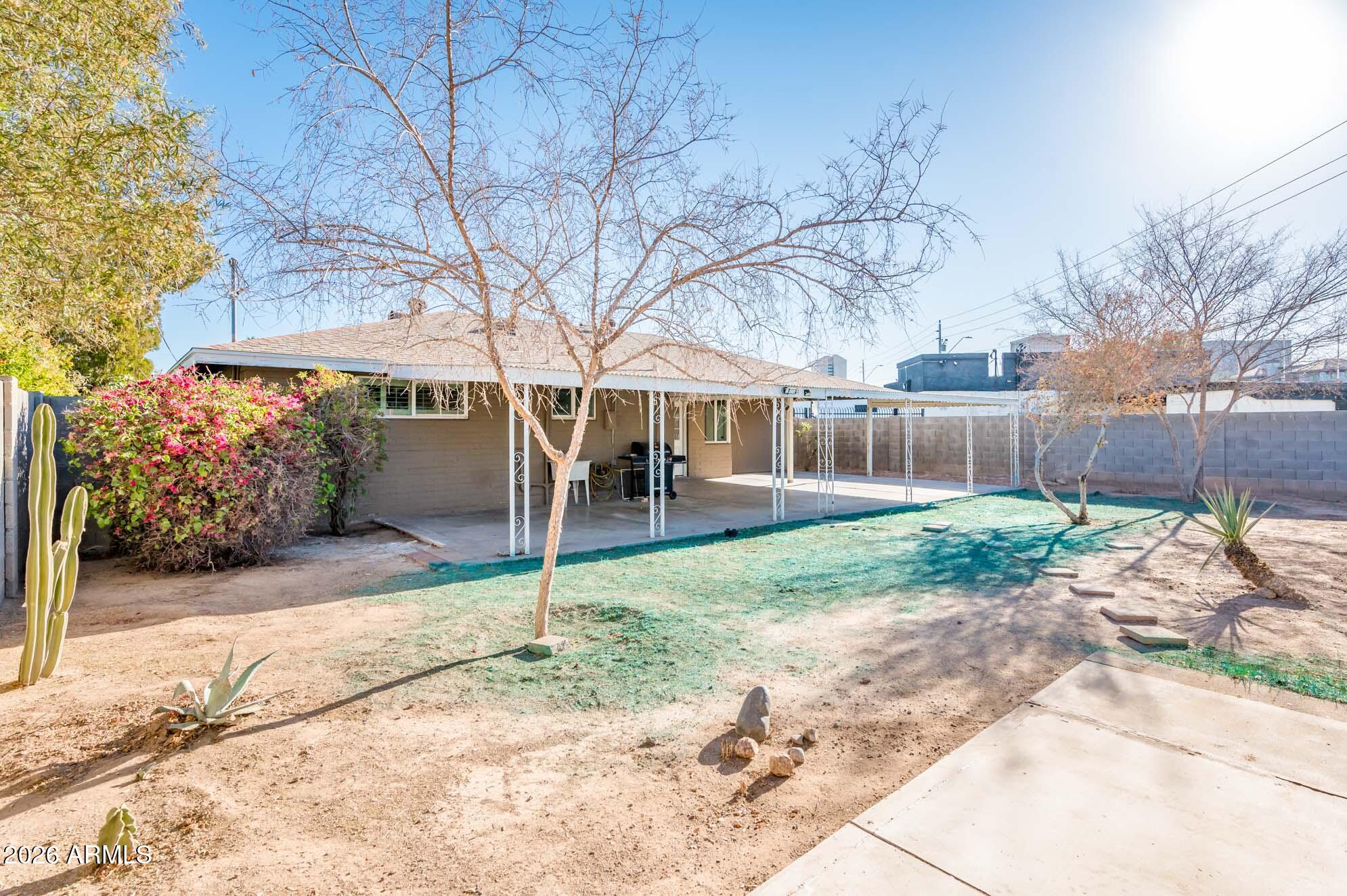 4112 6th Avenue Northwest Phoenix, AZ 85013 - Photo 22 of 23 a view of a house with a yard