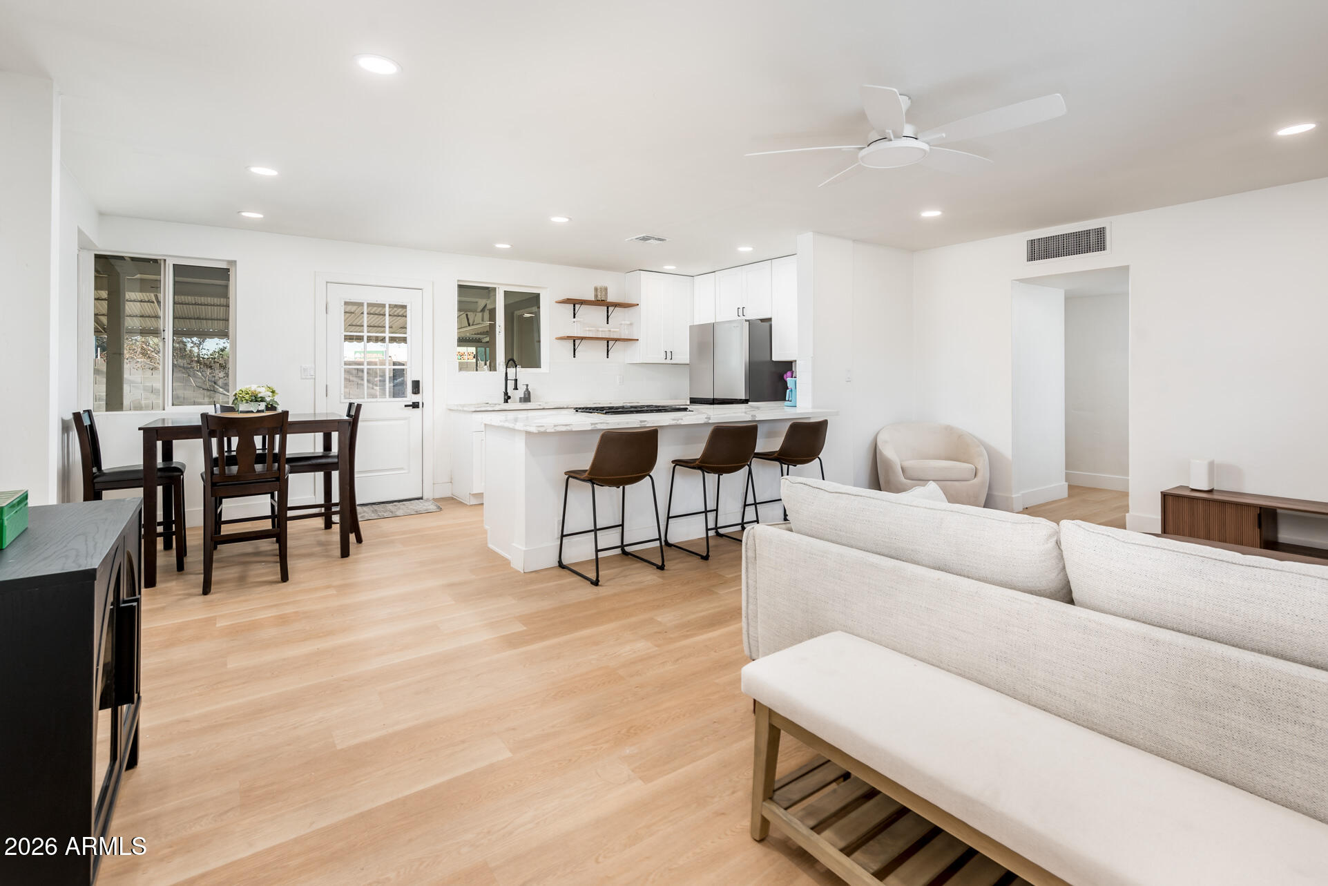 4112 6th Avenue Northwest Phoenix, AZ 85013 - Photo 5 of 23 a living room with furniture and wooden floor