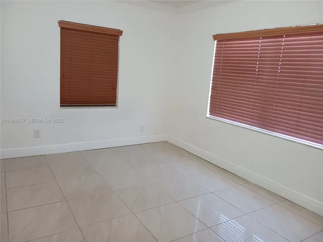 a view of a closet area with an entryway