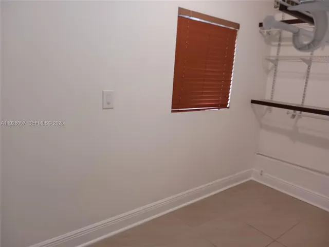 a view of small space with empty racks on the wall