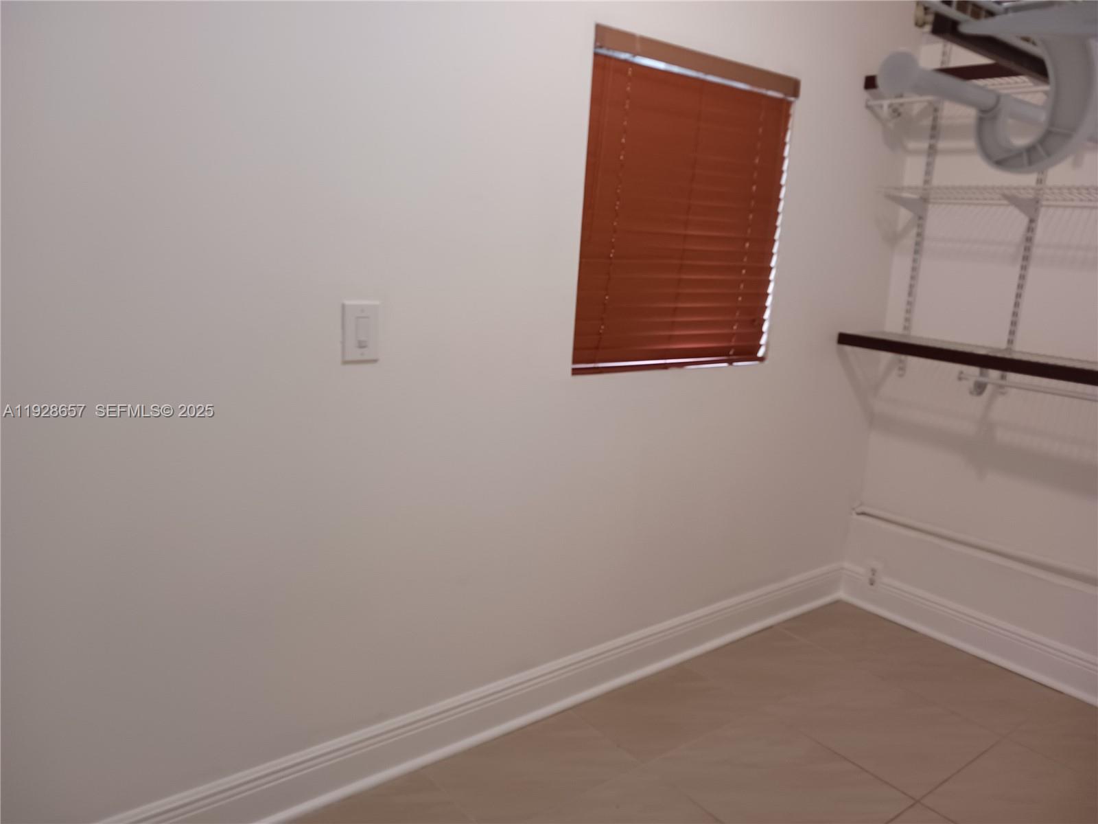 650 Southwest 44th Court Miami, FL 33134 - Photo 10 of 12 a view of small space with empty racks on the wall