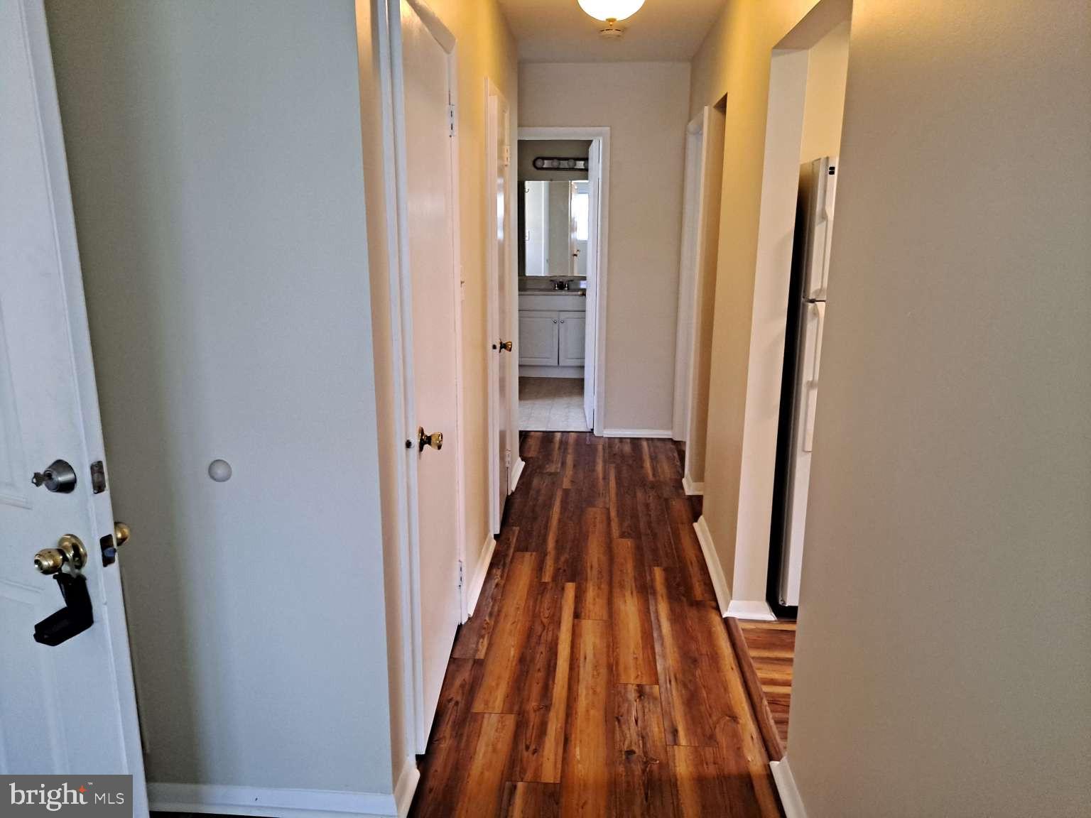 2 Florence Tollgate Florence, NJ 08518 - Photo 6 of 6 a view of a hallway with wooden floor and staircase
