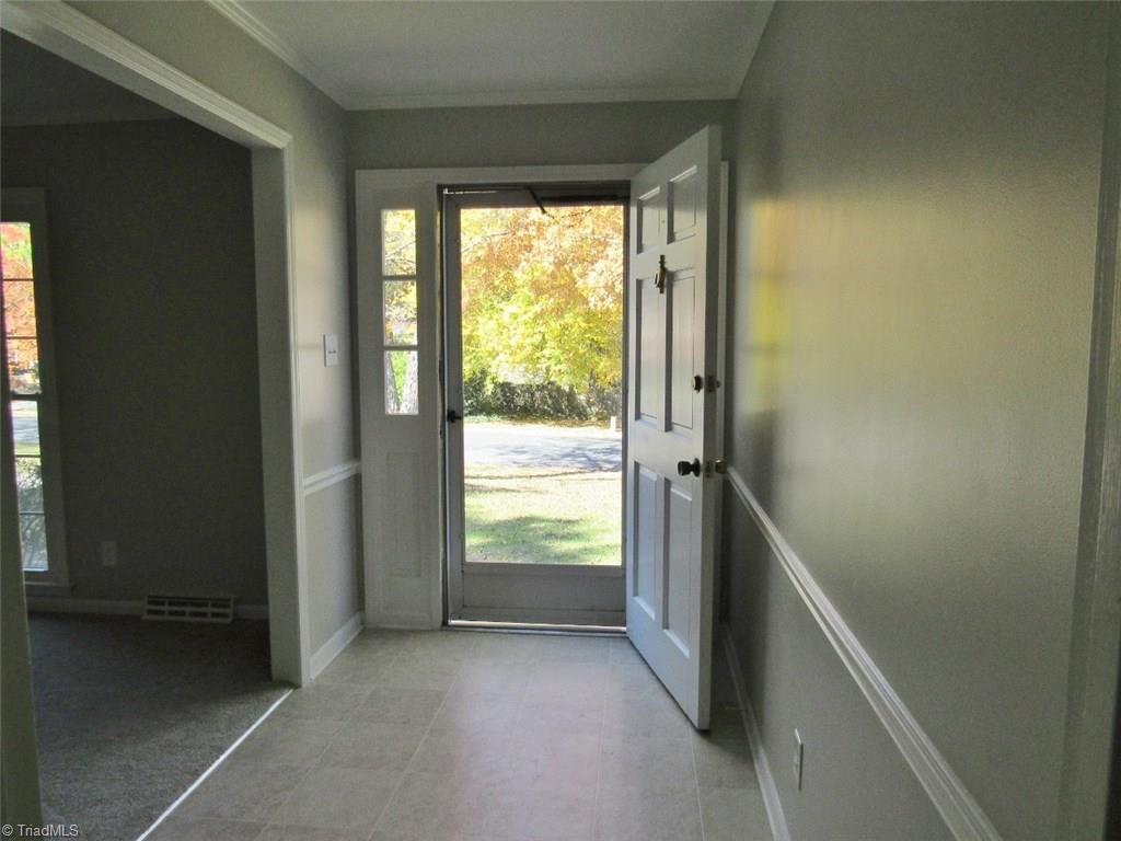 4502 Knightbridge Road Greensboro, NC 27455 - Photo 2 of 15 Enter into the foyer with fresh paint, crown moldings, smooth ceilings, new floor.