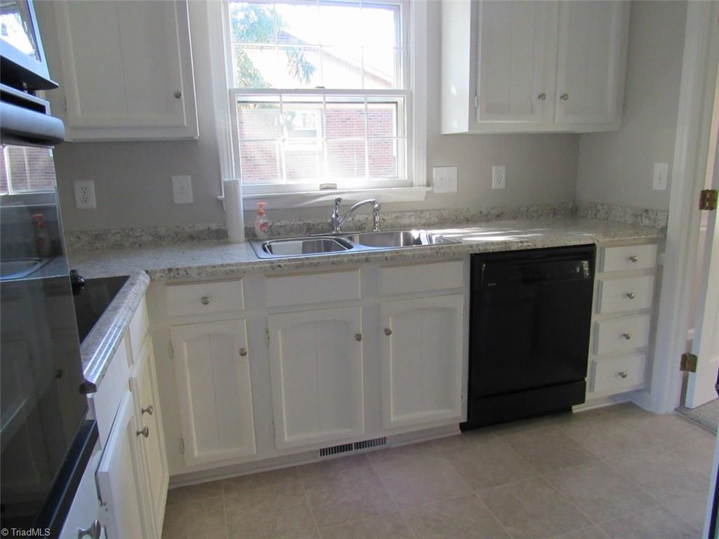 4502 Knightbridge Road Greensboro, NC 27455 - Photo 5 of 15 Kitchen, with new countertops, new dishwasher, new cook top, built in oven. Freshly painted, new floor.
