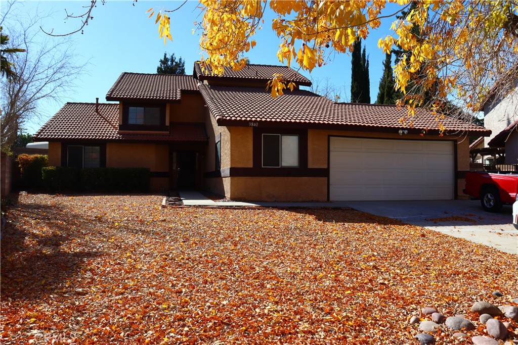 3840 Sago Street Lancaster, CA 93536 - Photo 2 of 23 a front view of a house with a yard