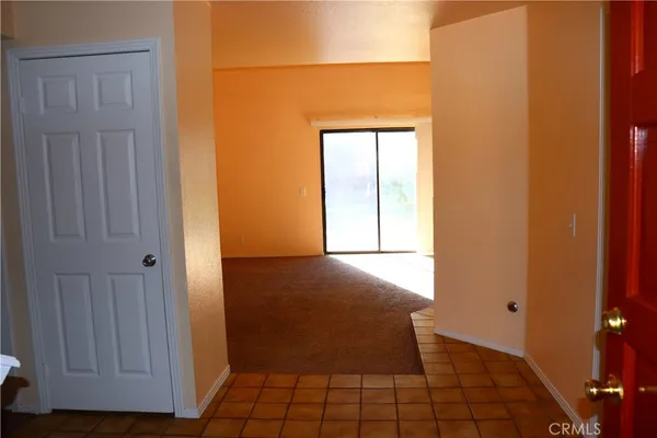 a view of a closet area with wooden floor