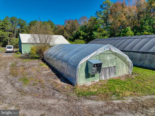 a view of a house with a yard and plants