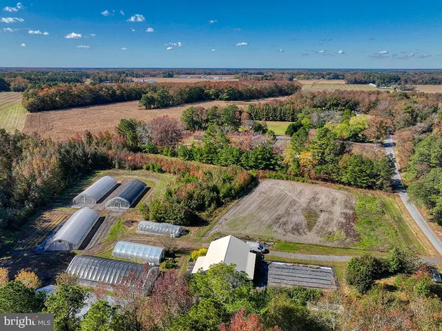 an aerial view of multiple house with a yard