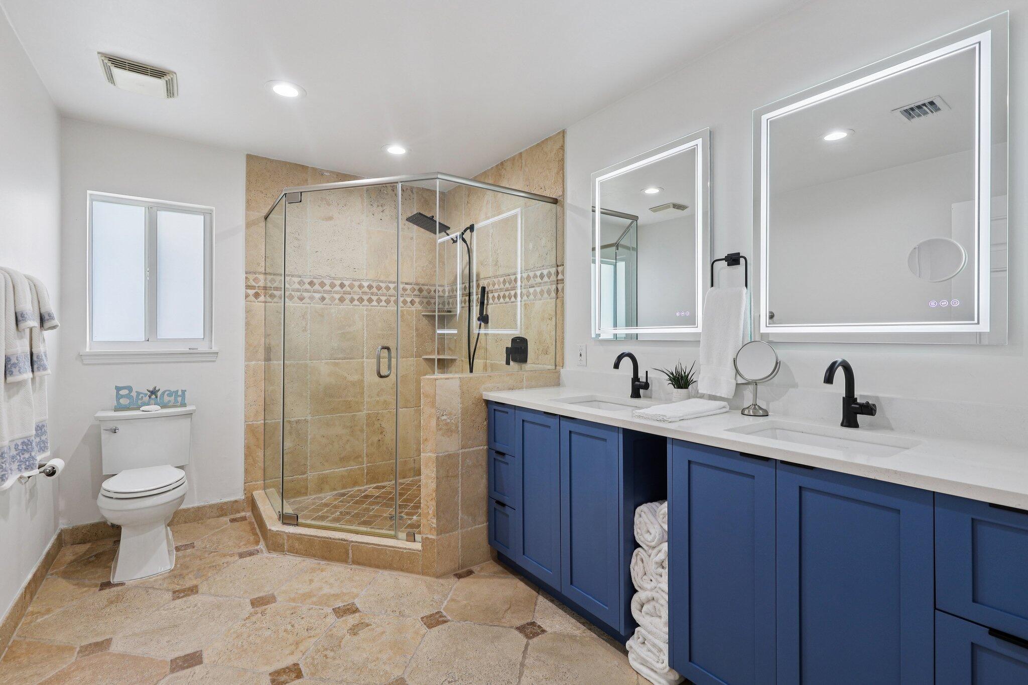 2731 Northeast 5th Street Pompano Beach, FL 33062 - Photo 30 of 91 a bathroom with a shower sink vanity mirror and toilet