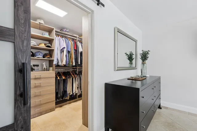 an aerial view of a house with a lake view