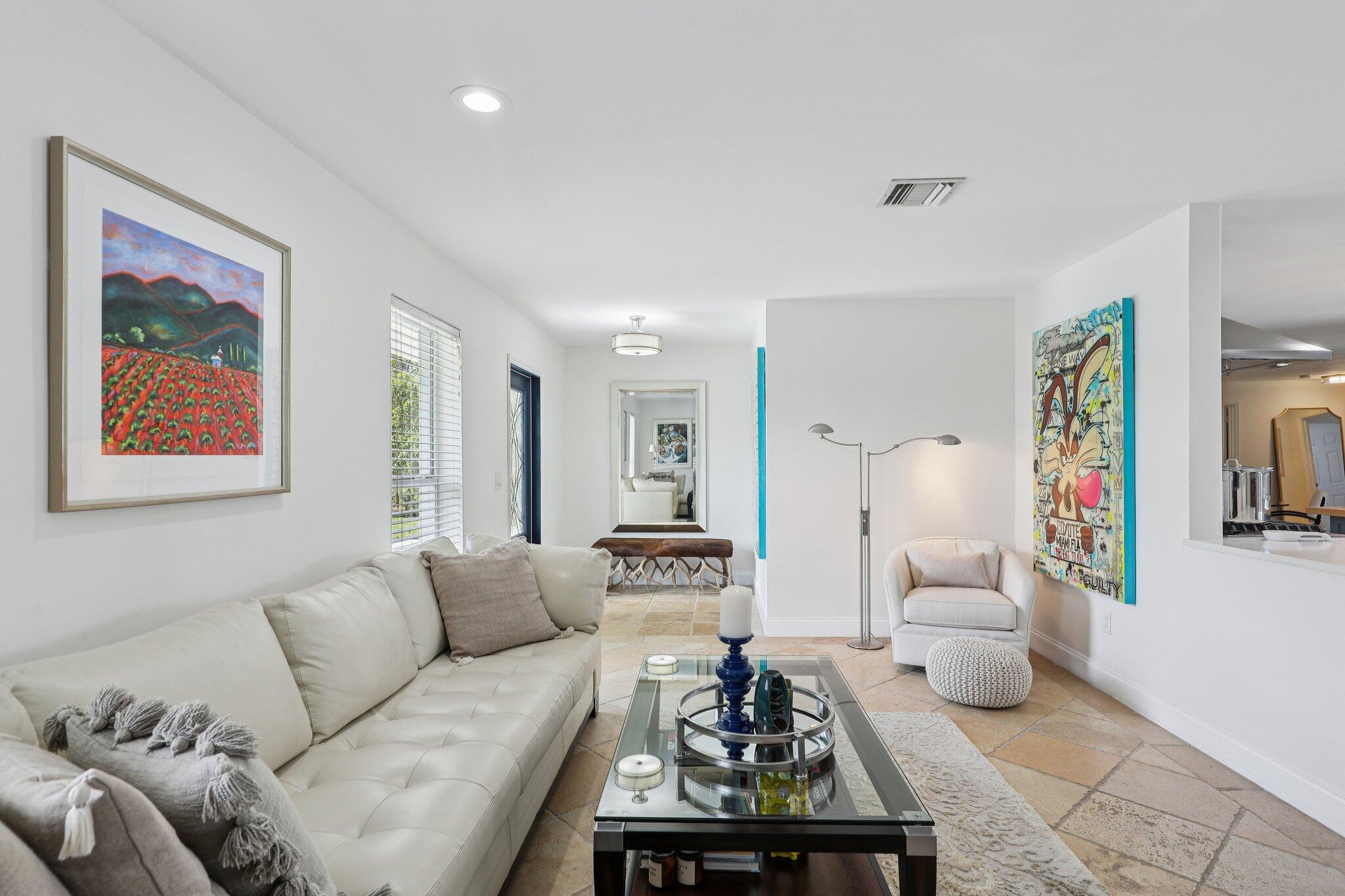 2731 Northeast 5th Street Pompano Beach, FL 33062 - Photo 9 of 91 a living room with furniture and a couch