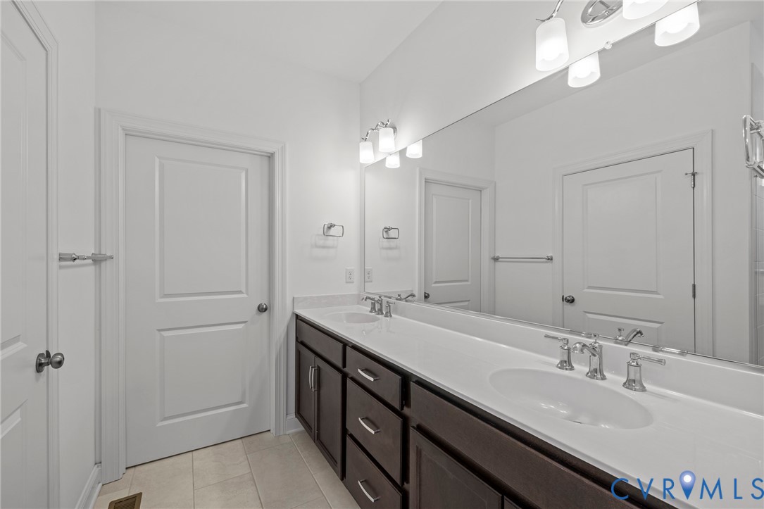 224 Lauradell Road Ashland, VA 23005 - Photo 28 of 74 Bathroom featuring a dual vanity with dark wood-fi