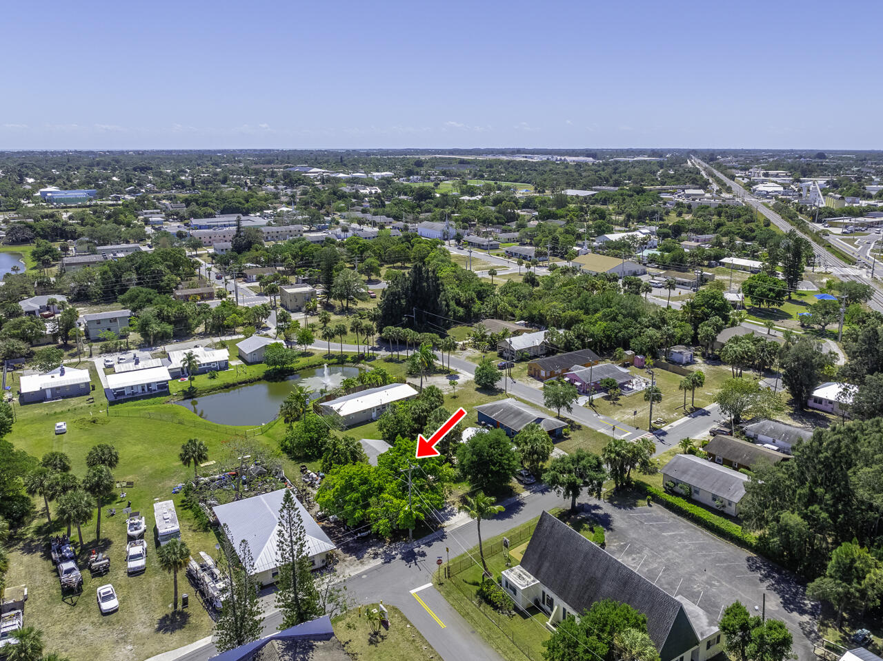 801 Central Avenue Stuart, FL 34994 - Photo 4 of 12 an aerial view of residential houses with outdoor space and swimming pool