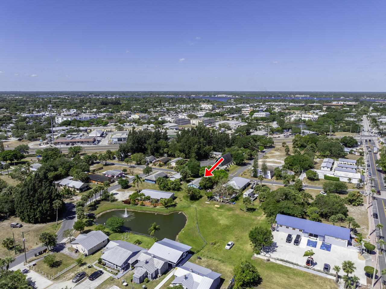 801 Central Avenue Stuart, FL 34994 - Photo 9 of 12 an aerial view of residential houses with outdoor space