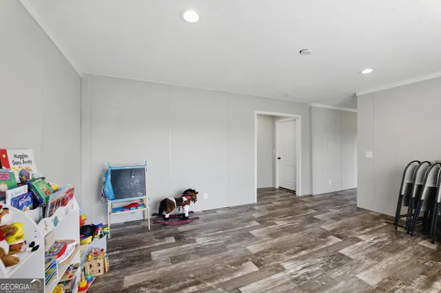 a view of a livingroom with baby furniture
