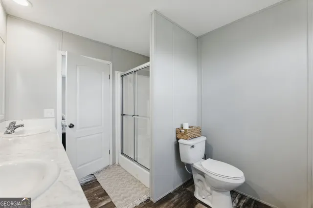 a view of a lake with wooden floor