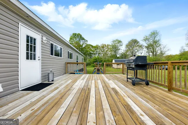 a view of a house with a yard patio and fire pit