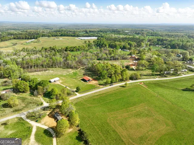 a view of a field with an trees