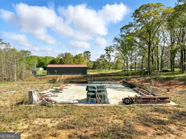 a view of a field with an ocean