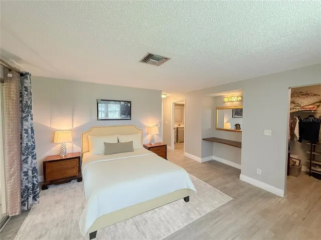 a bedroom with a bed and a view of bedroom