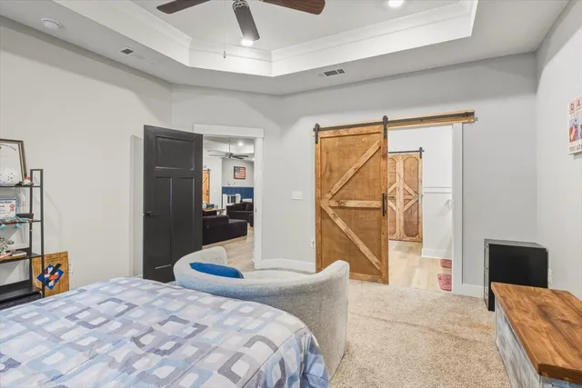 a bedroom with a bed and a television