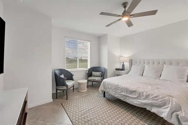 a spacious bathroom with double sink and a mirror