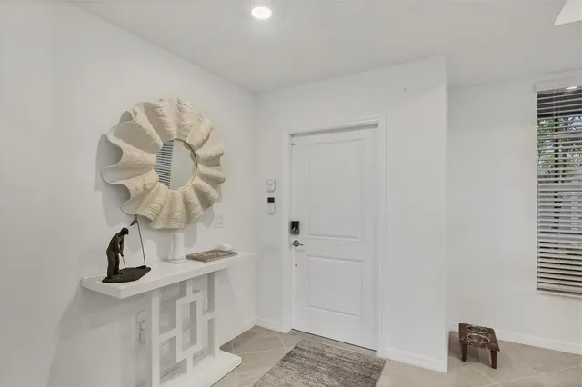 a kitchen with stainless steel appliances a refrigerator stove microwave and sink