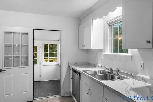 a kitchen that has a sink and a window