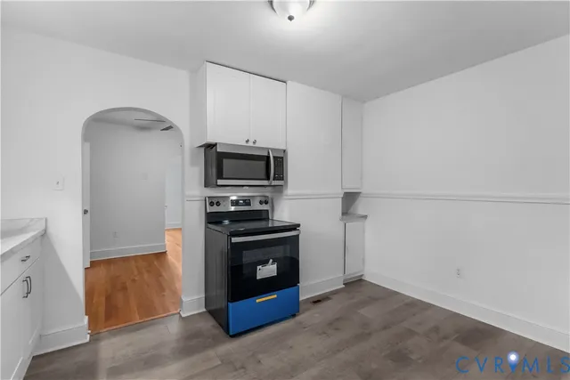 a kitchen with a refrigerator stove and microwave
