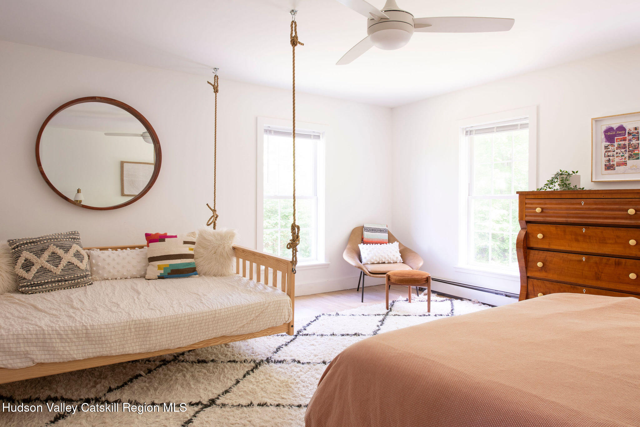 31 Laurel Hollow Road Kerhonkson, NY 12446 - Photo 19 of 47 a bedroom with a bed a mirror and a window
