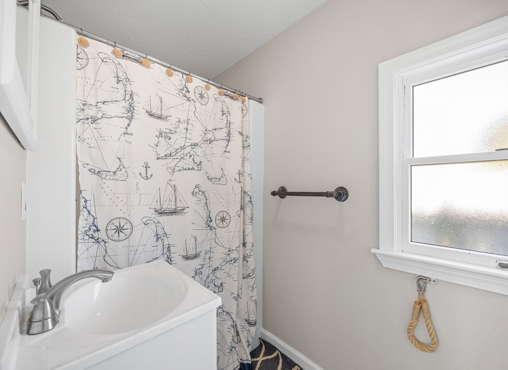17 5th Street Wareham, MA 02558 - Photo 15 of 32 a bathroom with a sink and a window