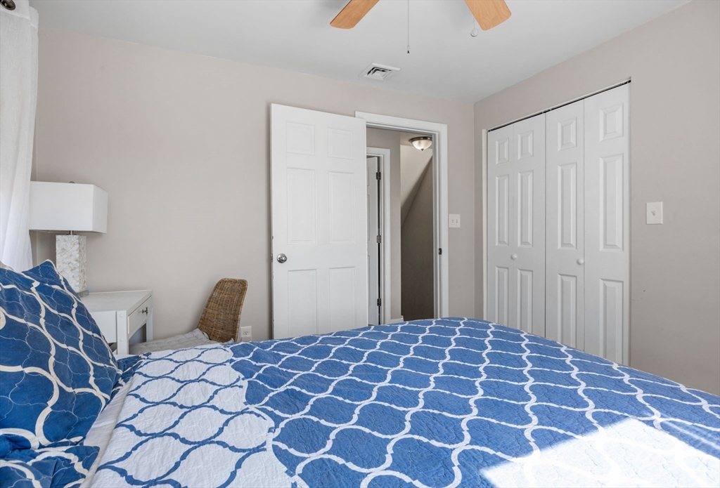 17 5th Street Wareham, MA 02558 - Photo 19 of 32 a bedroom with a bed and a lamp