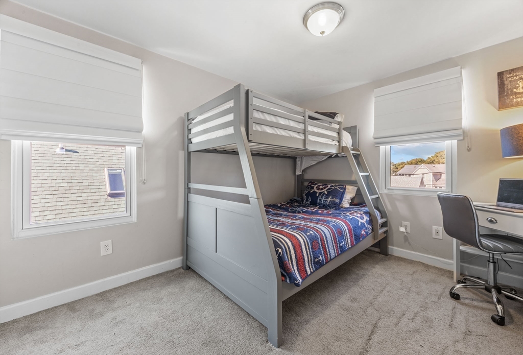 17 5th Street Wareham, MA 02558 - Photo 25 of 32 a bedroom with a bed and a chair in it