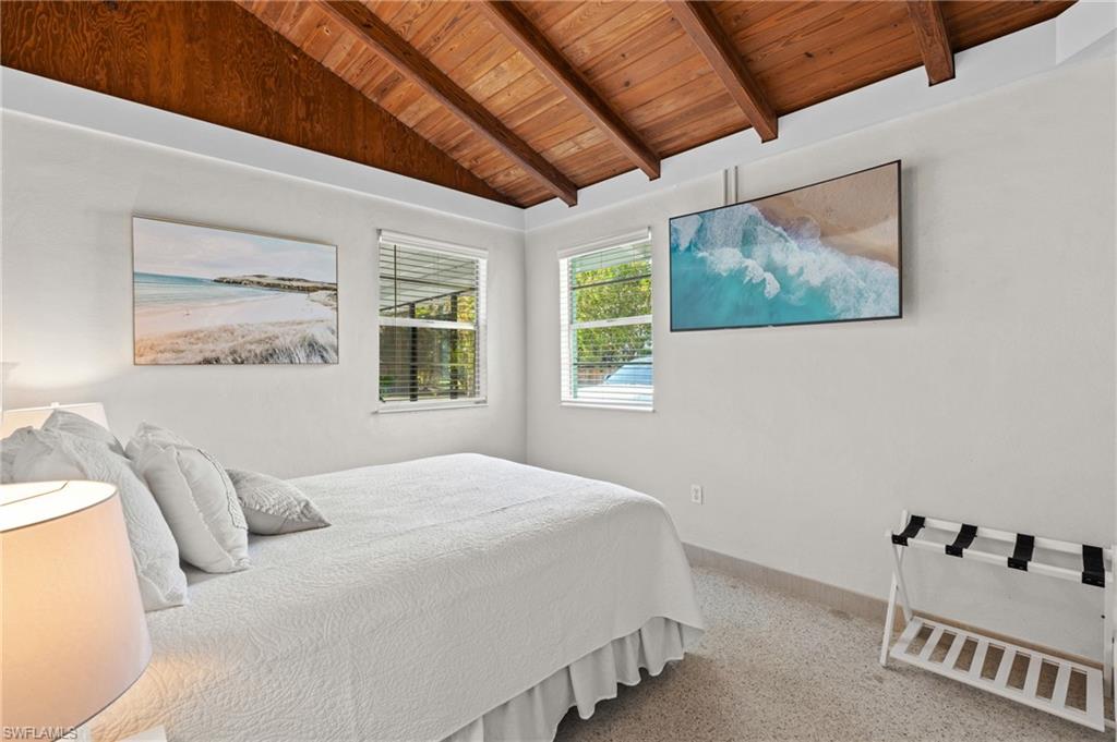 2134 Palm Street Naples, FL 34112 - Photo 12 of 36 a bedroom with a bed and a window