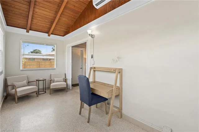 a bedroom with furniture and a window