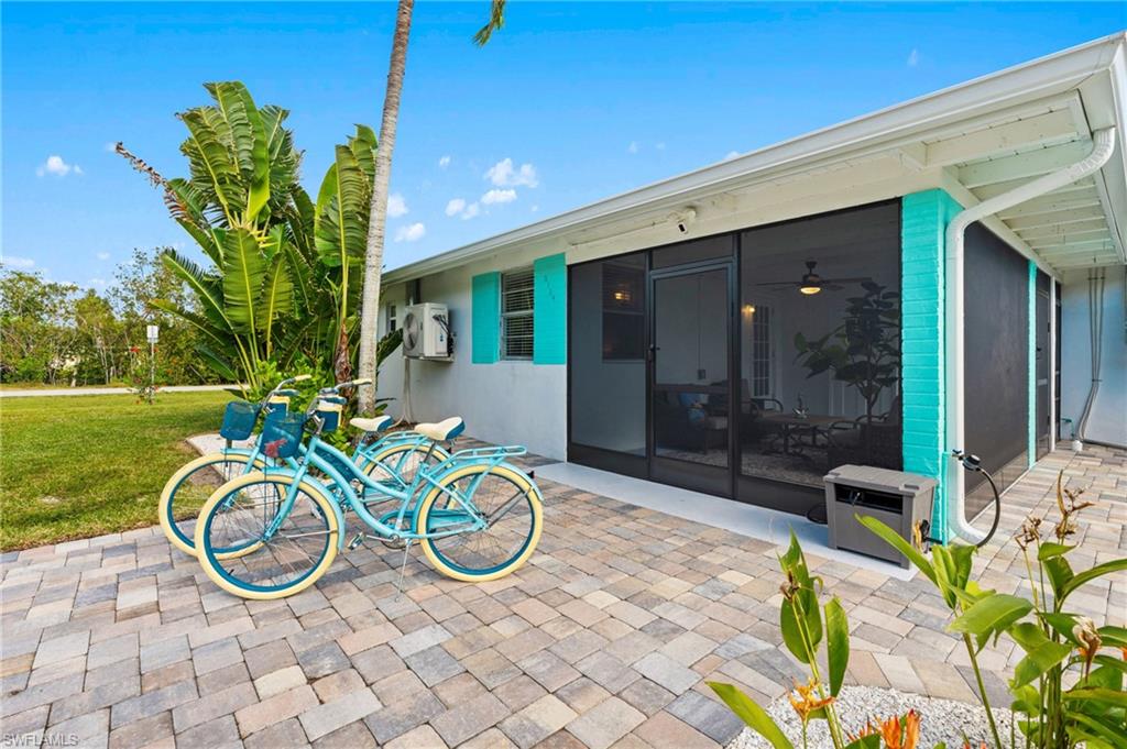 2134 Palm Street Naples, FL 34112 - Photo 2 of 36 a view of a porch with furniture