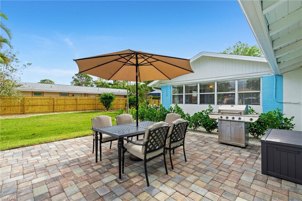 2134 Palm Street Naples, FL 34112 - Photo 21 of 36 a view of a chair and table on the garden