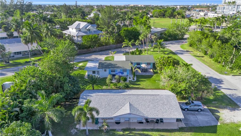 2134 Palm Street Naples, FL 34112 - Photo 32 of 36 an aerial view of house with yard swimming pool and outdoor seating