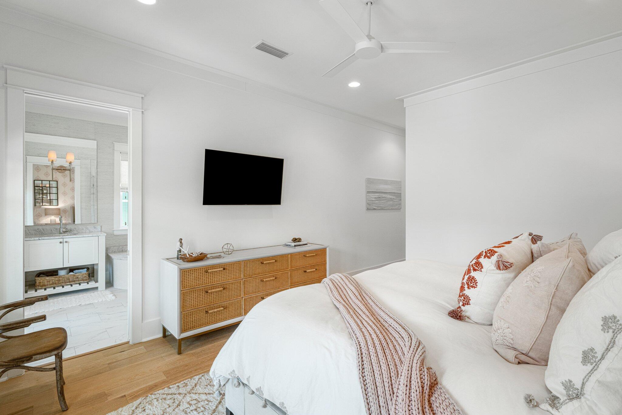 916 Pathways Dr Inlet Beach Inlet Beach, FL 32461 - Photo 14 of 48 a bedroom with a bed and a flat screen tv