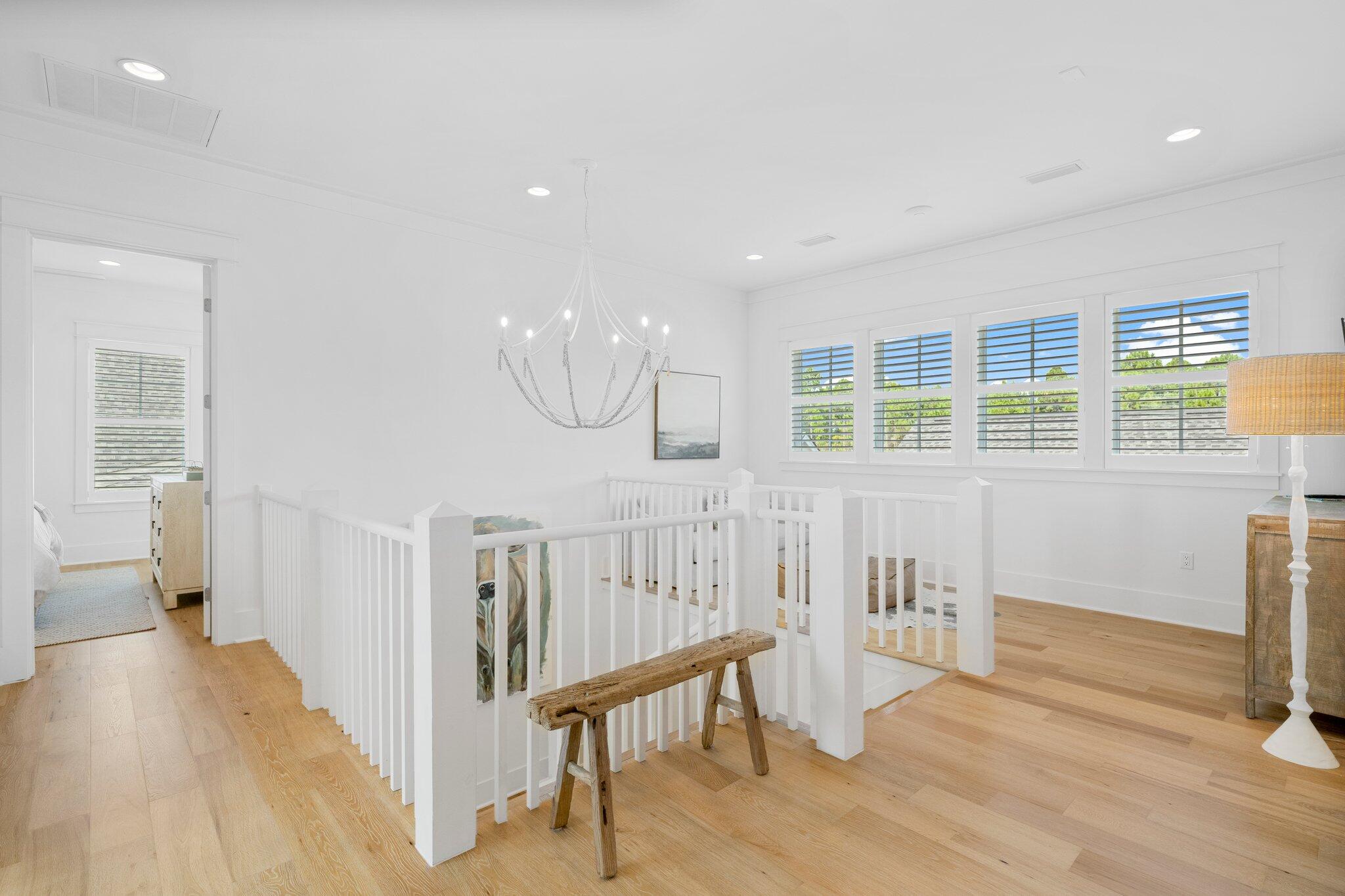 916 Pathways Dr Inlet Beach Inlet Beach, FL 32461 - Photo 22 of 48 a view of a hallway with wooden floor and windows