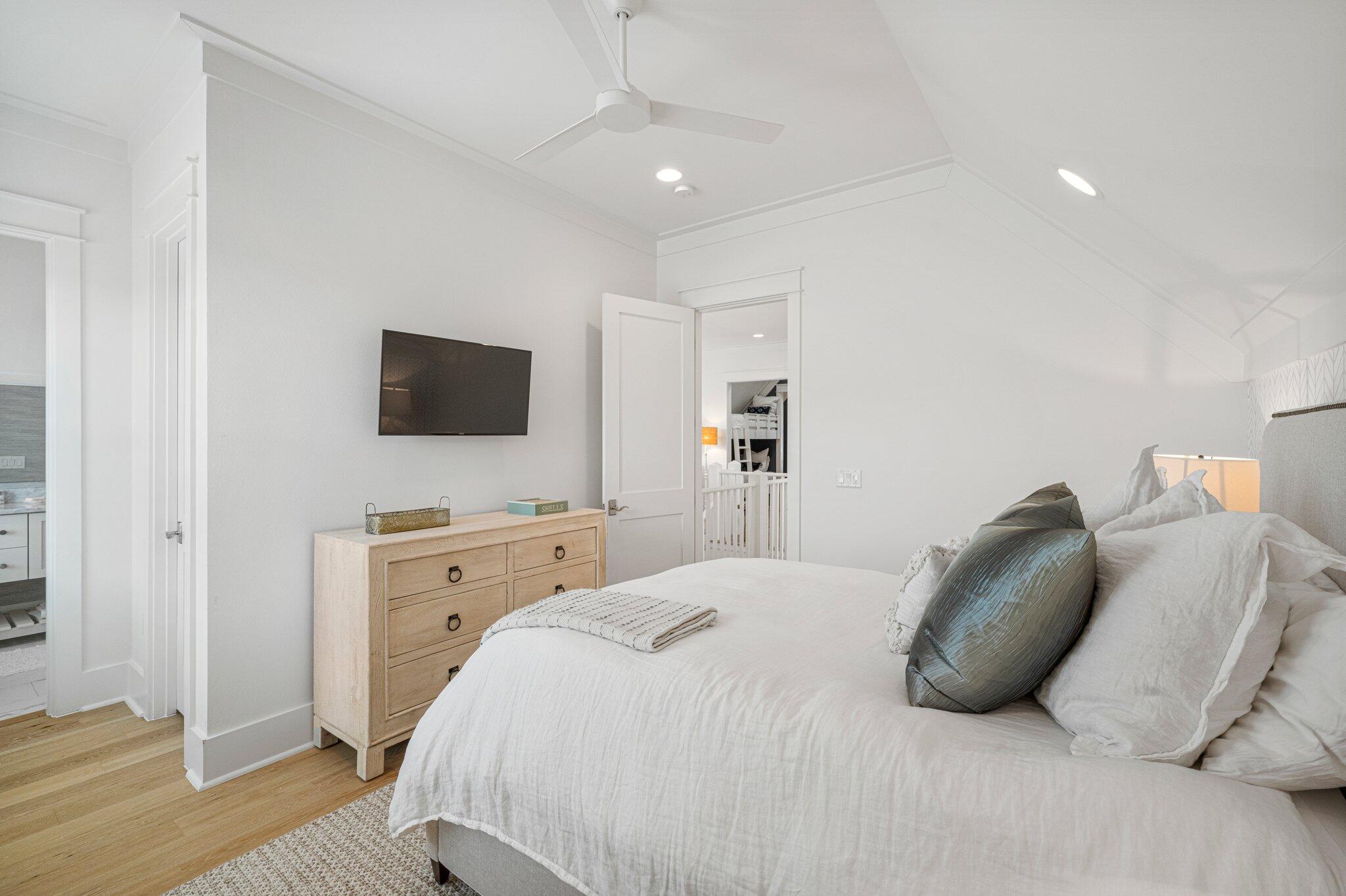 916 Pathways Dr Inlet Beach Inlet Beach, FL 32461 - Photo 33 of 48 a bedroom with a bed and a flat screen tv