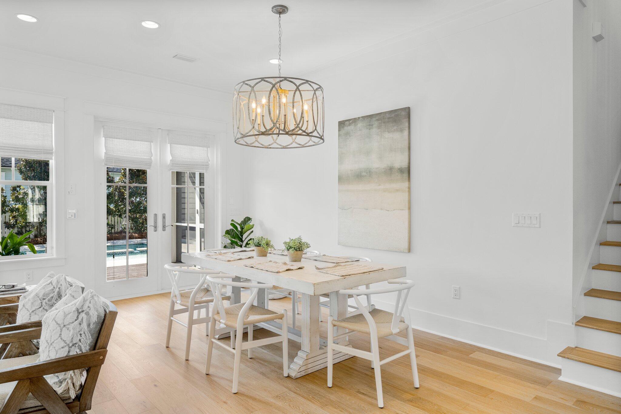 916 Pathways Dr Inlet Beach Inlet Beach, FL 32461 - Photo 10 of 48 a view of a dining room with furniture a chandelier and wooden floor