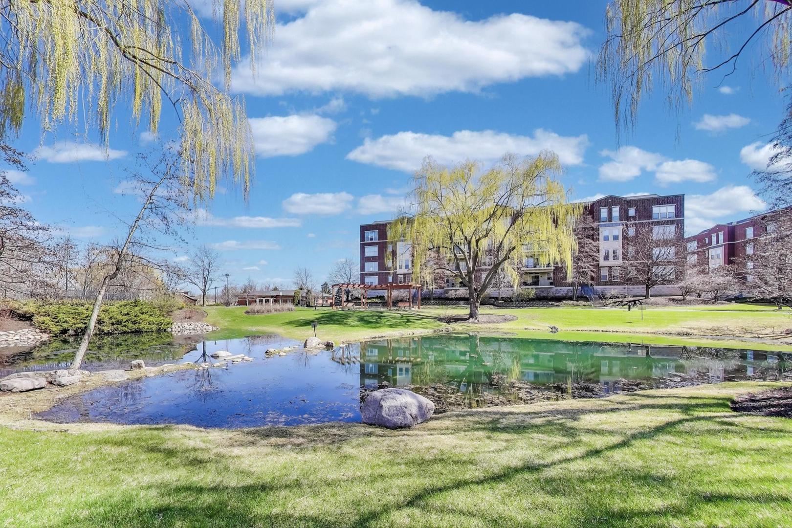 a swimming pool with outdoor seating and yard