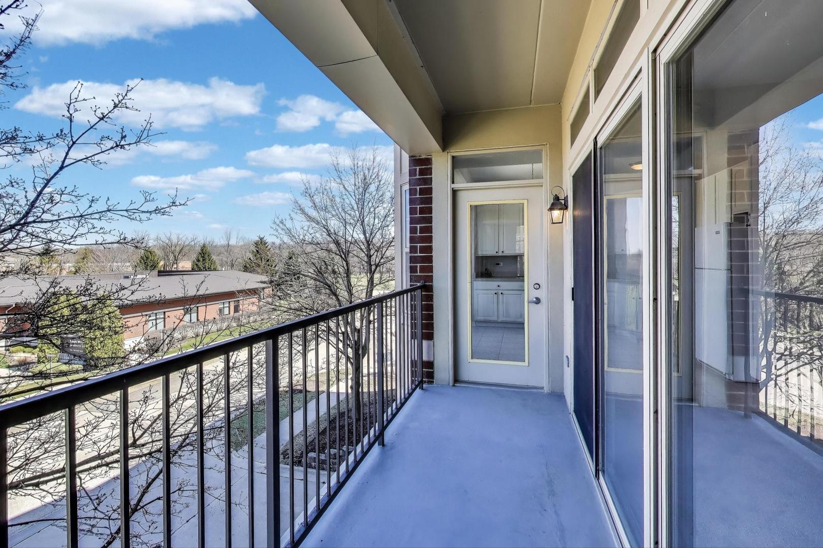 715 Astor Lane, Unit 307 Wheeling, IL 60090 - Photo 14 of 38 a view of a balcony with wooden floor