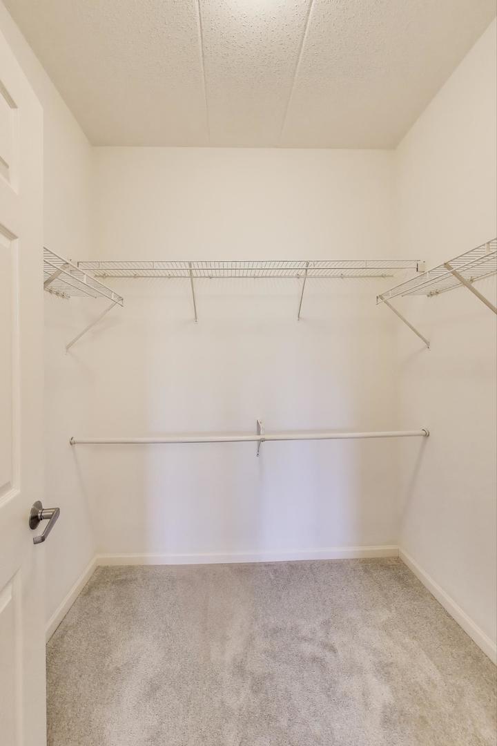 715 Astor Lane, Unit 307 Wheeling, IL 60090 - Photo 20 of 38 a view of a room with racks on the wall