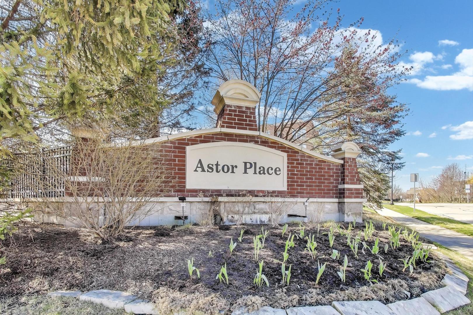715 Astor Lane, Unit 307 Wheeling, IL 60090 - Photo 2 of 38 a sign on the side of a road