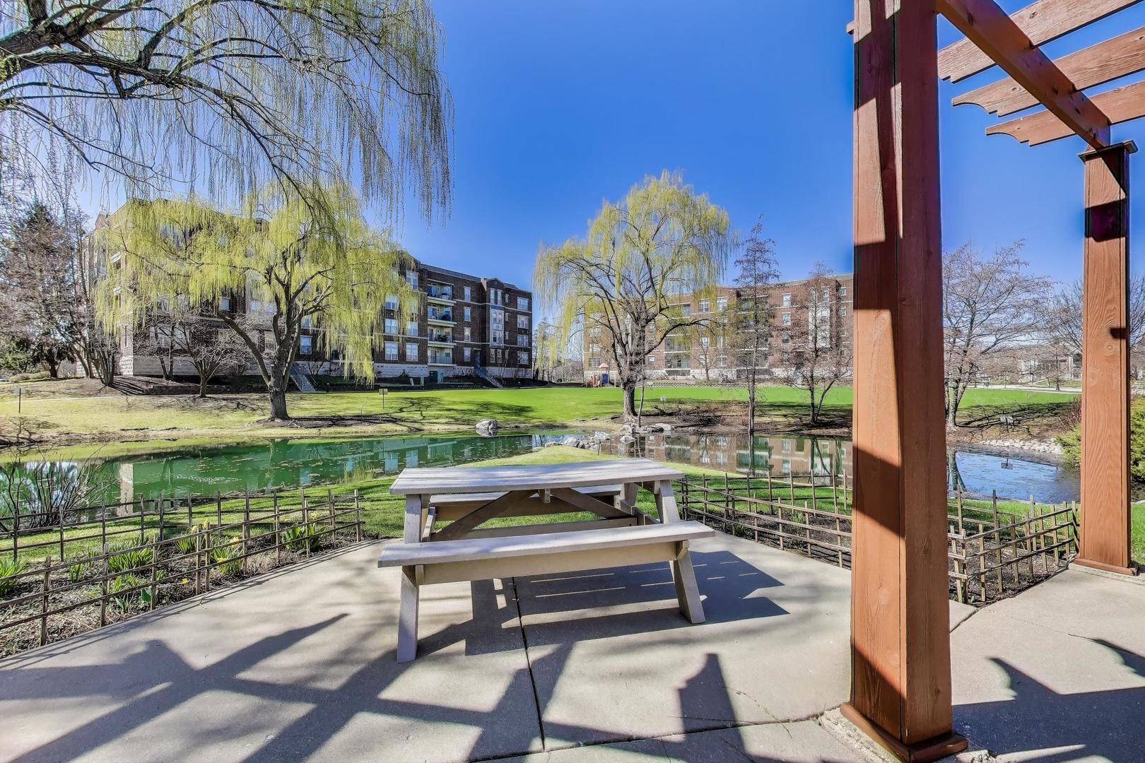 715 Astor Lane, Unit 307 Wheeling, IL 60090 - Photo 32 of 38 a house view with a garden space