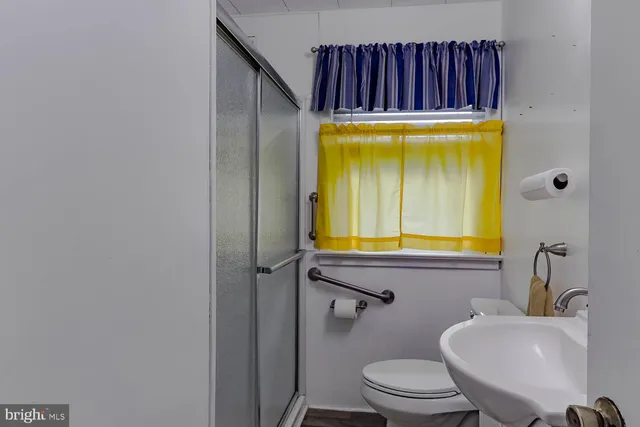 a bathroom with a toilet and a sink